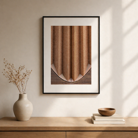 Minimalist brown abstract wall art framed above a wooden console table with neutral decor in a modern interior